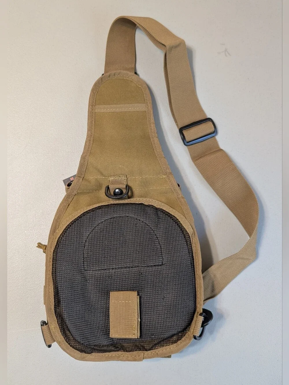 New tan tactical sling pack with holster
